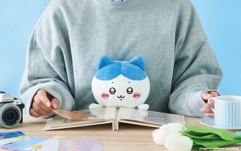 Hachiware Posture Pal plush shown at a desk